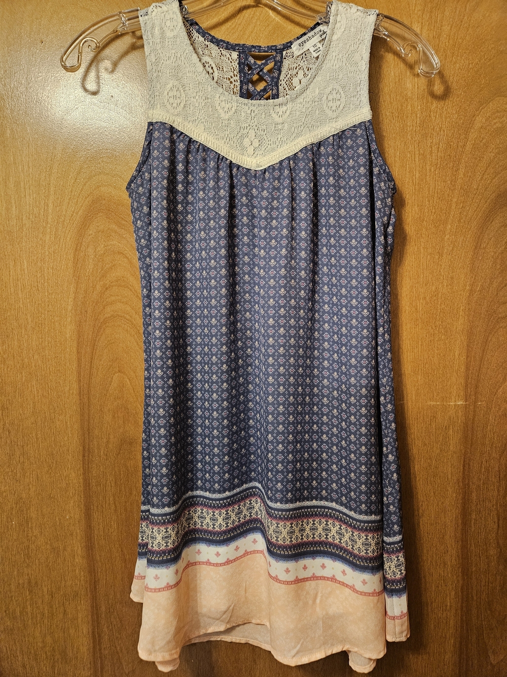 Eyeshadow Navy Blue Printed Sleeveless Dress with Cream Lace Yoke and Peach Hem